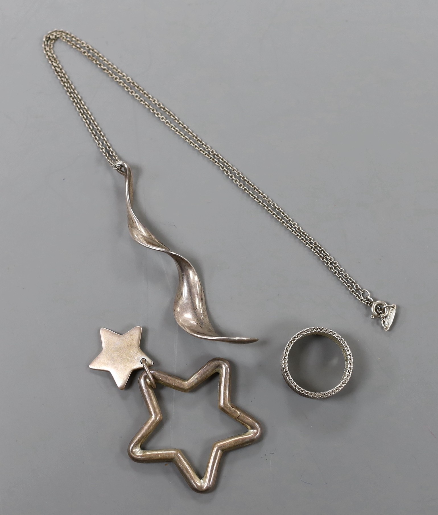 A modern Tiffany & Co. sterling ring, size O/P and a similar pendant and key ring.